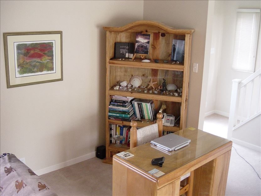 Den with bookshelf and reading table